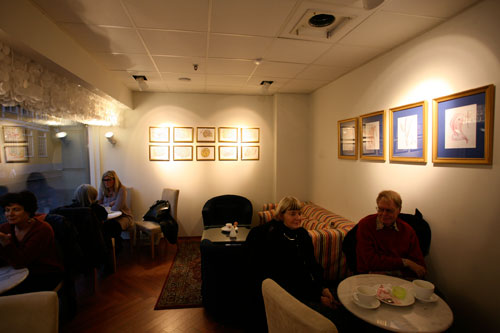 Guests enjoying coffee and the Jharna Kala art of Sri Chinmoy